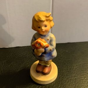 Antique figurine little girl with bouquet